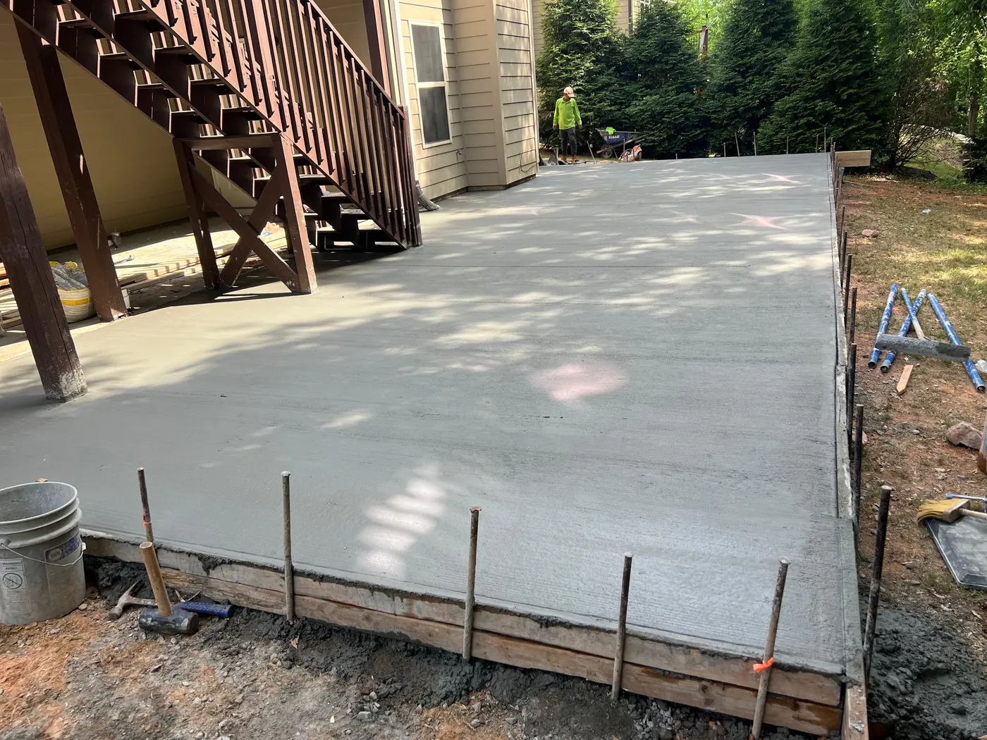 Large backyard concrete patio installation in Lawrenceville GA